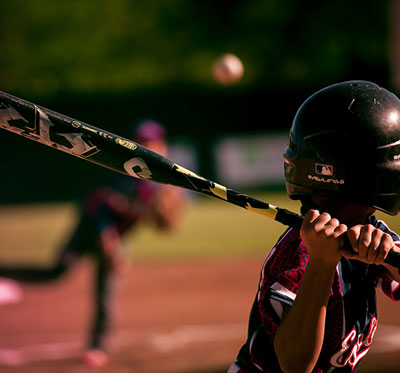 Baseball player aiming for the ball